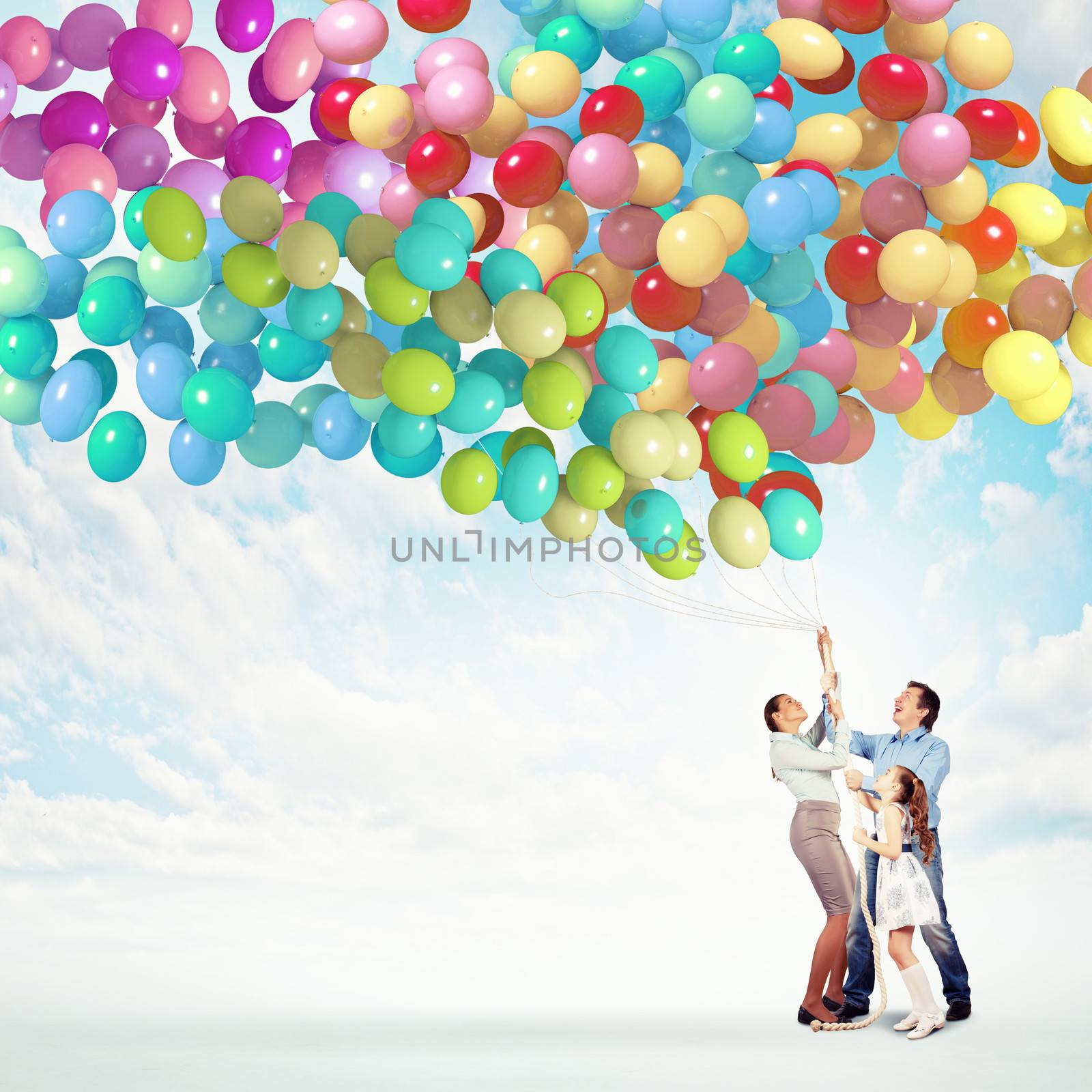 Family holding colorful balloons by sergey_nivens