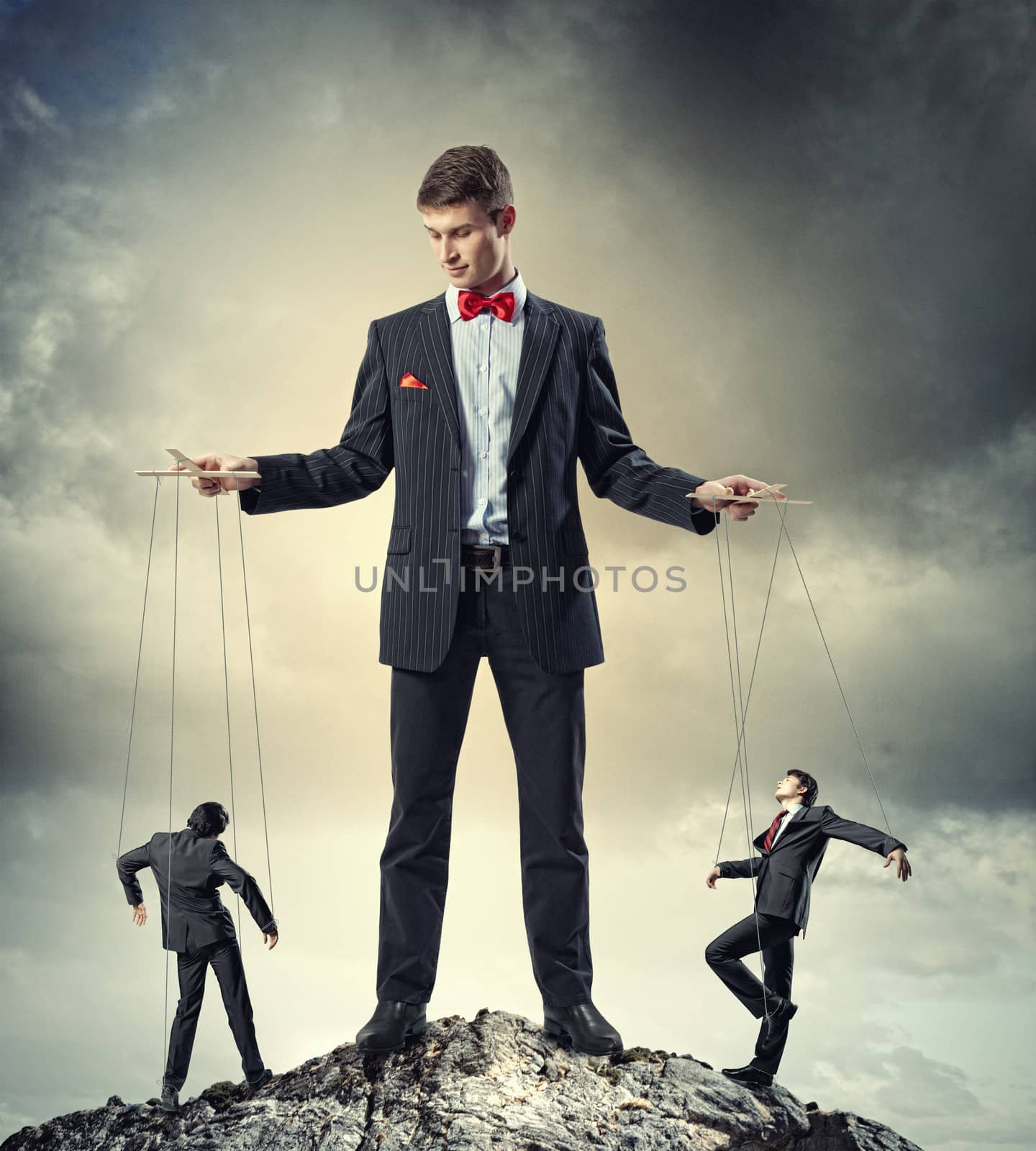 Businessman puppeteer by sergey_nivens