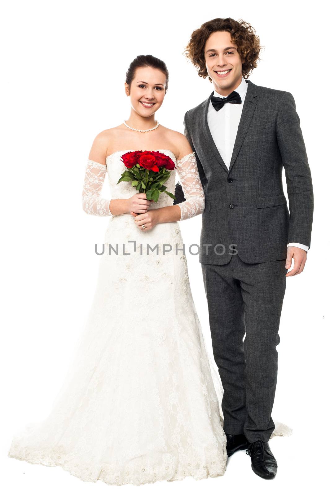 Happy young bride and groom, white background