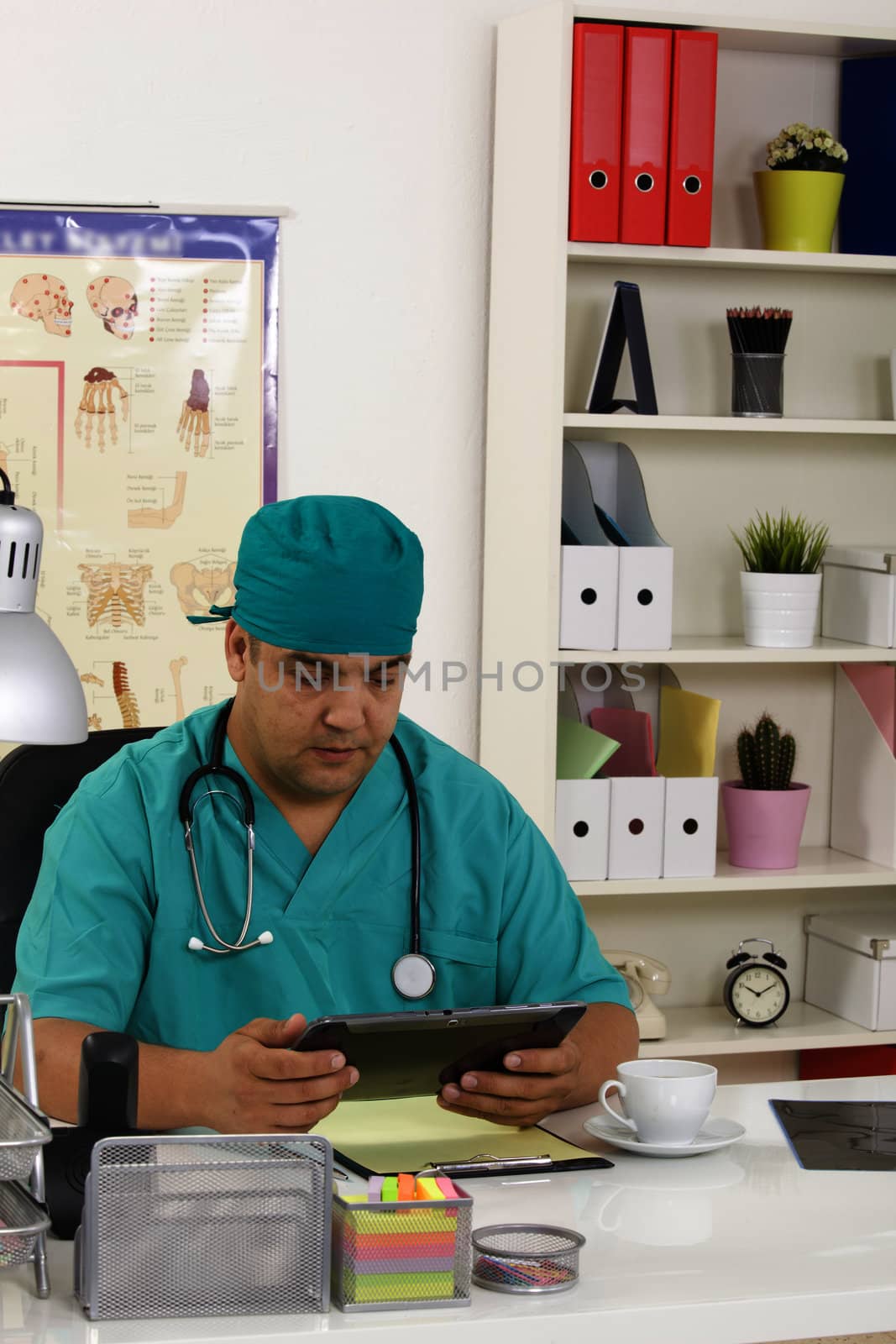 Doctor working on a digital tablet