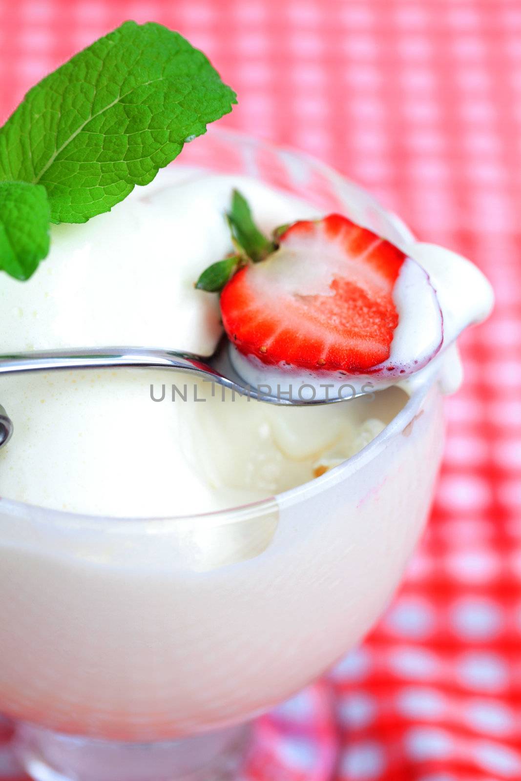 ice cream,strawberry with mint in a glass bowl on plaid fabric by jannyjus