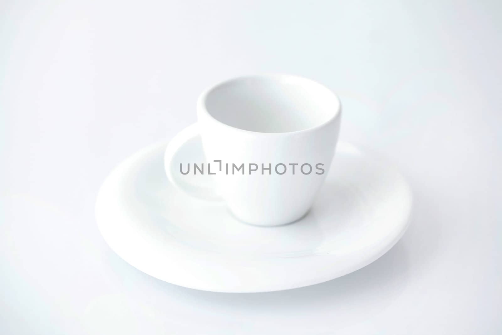 white cup with saucer  by jannyjus