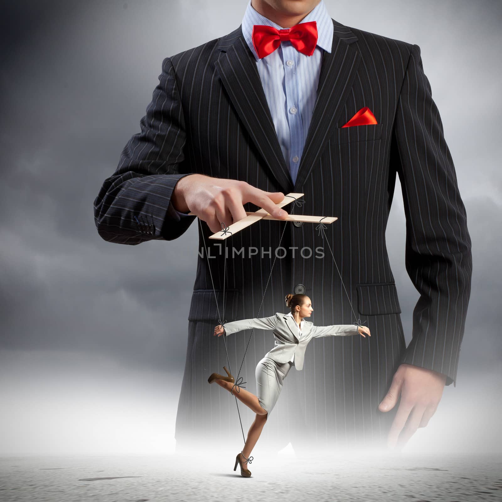 Image of young businessman puppeteer. Leadership concept