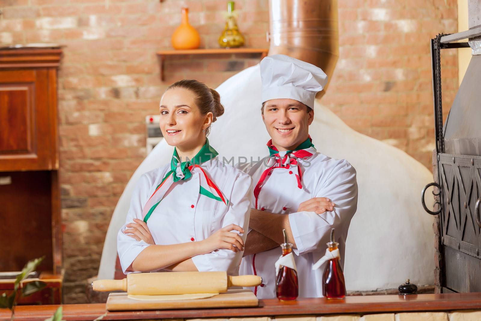 Portrait of two cooks with crossed arms by sergey_nivens