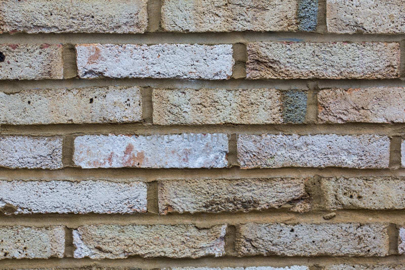 Weathered brick wall texture background by stockyimages