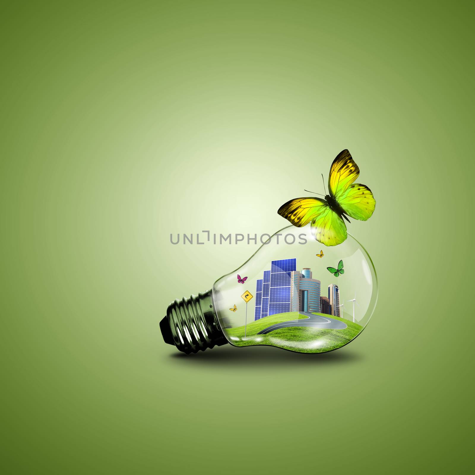 Electric light bulb and a plant inside it as symbol of green energy