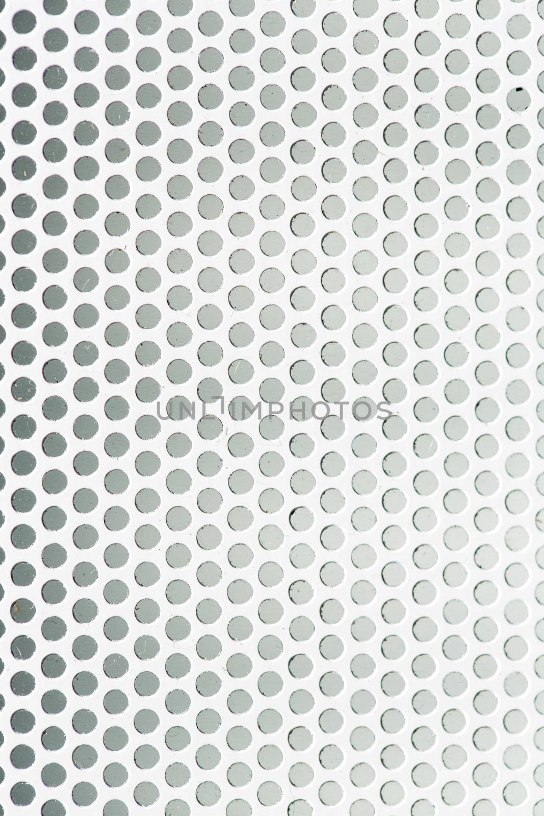 Perforated metal grid texture by stockyimages