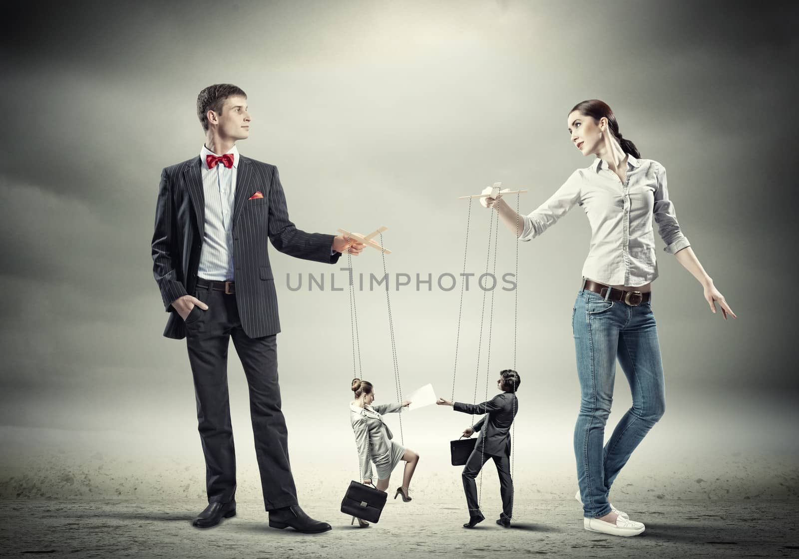 Businesspeople with marionettes by sergey_nivens