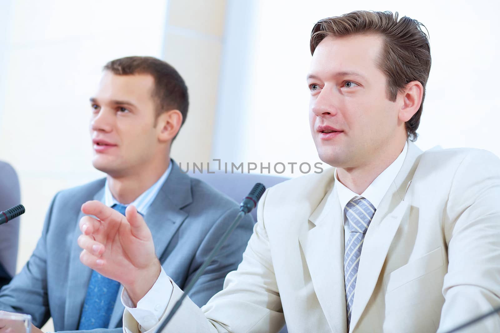 Two businesspeople at meeting by sergey_nivens
