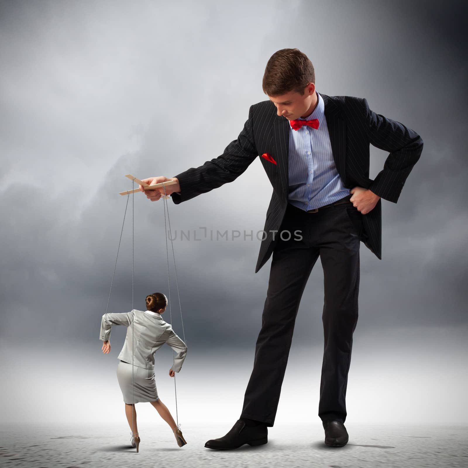 Image of young businessman puppeteer. Leadership concept