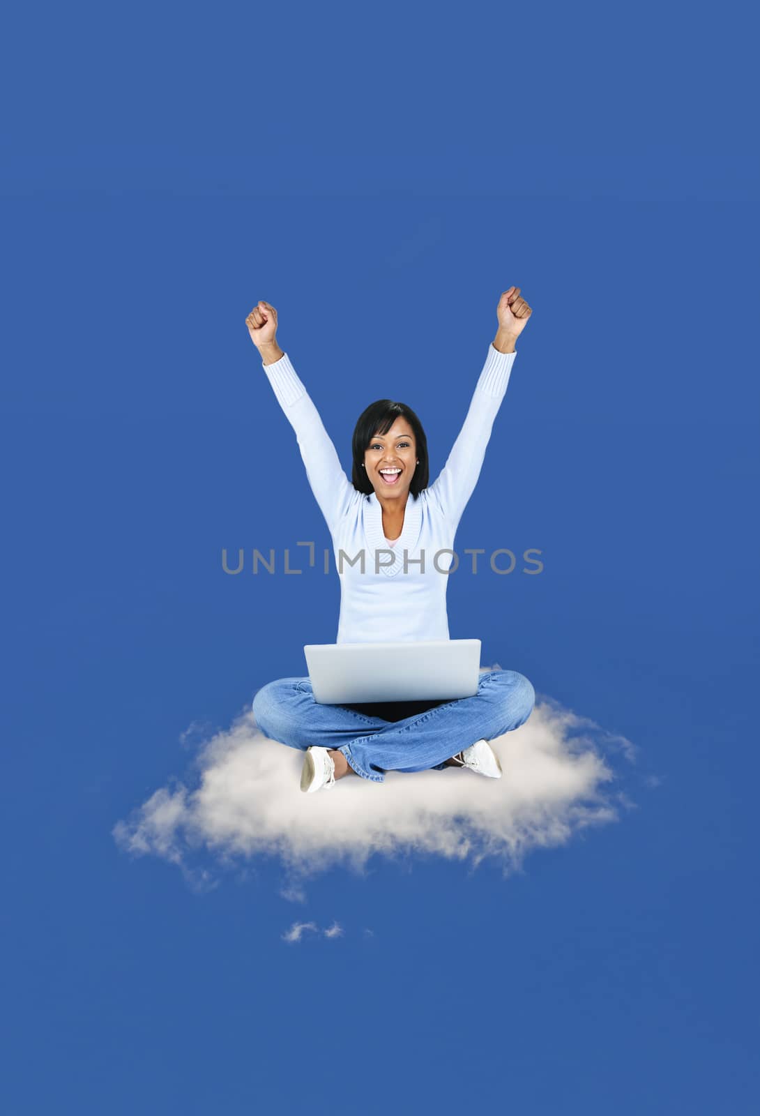 Happy woman computing on cloud by elenathewise