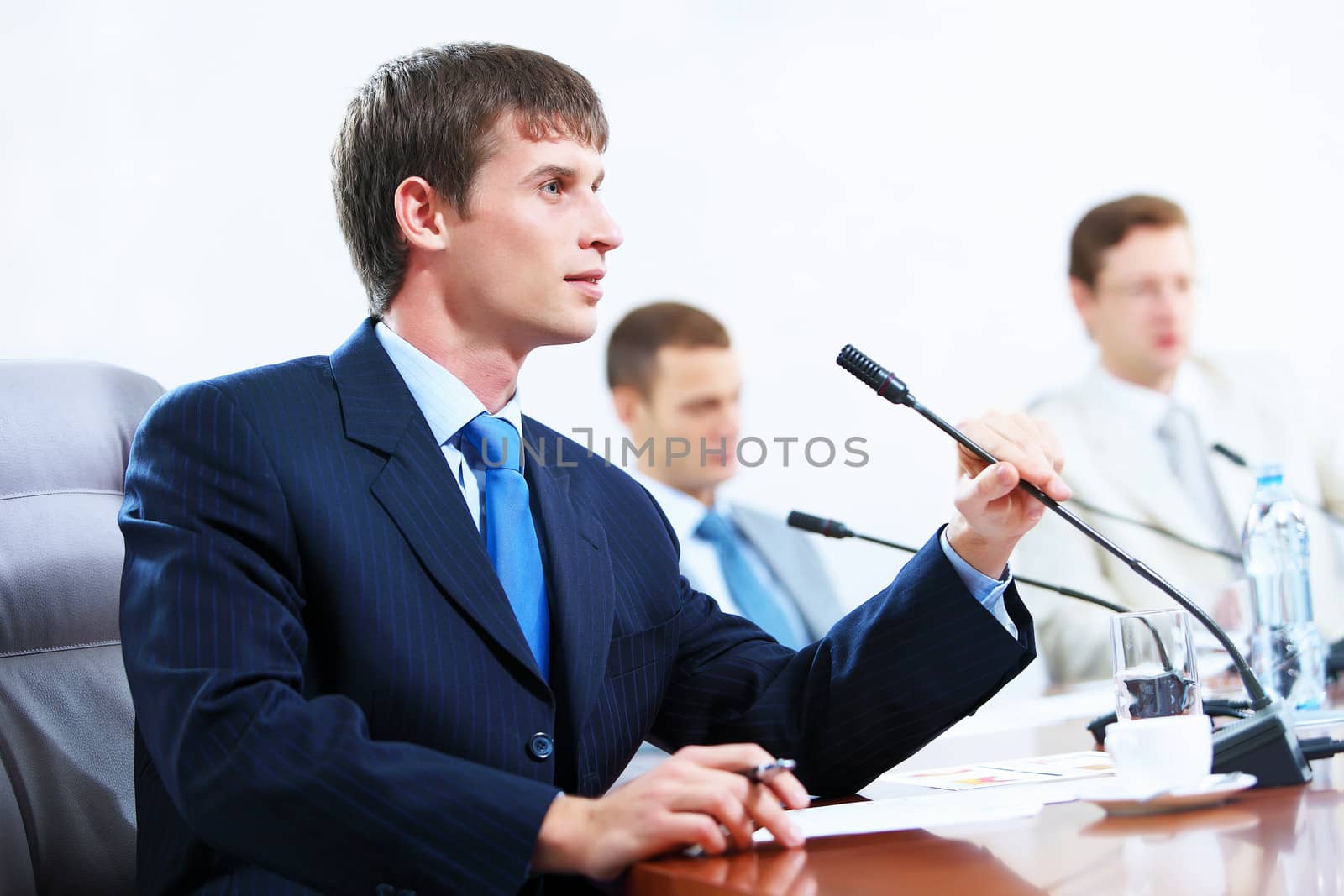 Three businesspeople at meeting by sergey_nivens