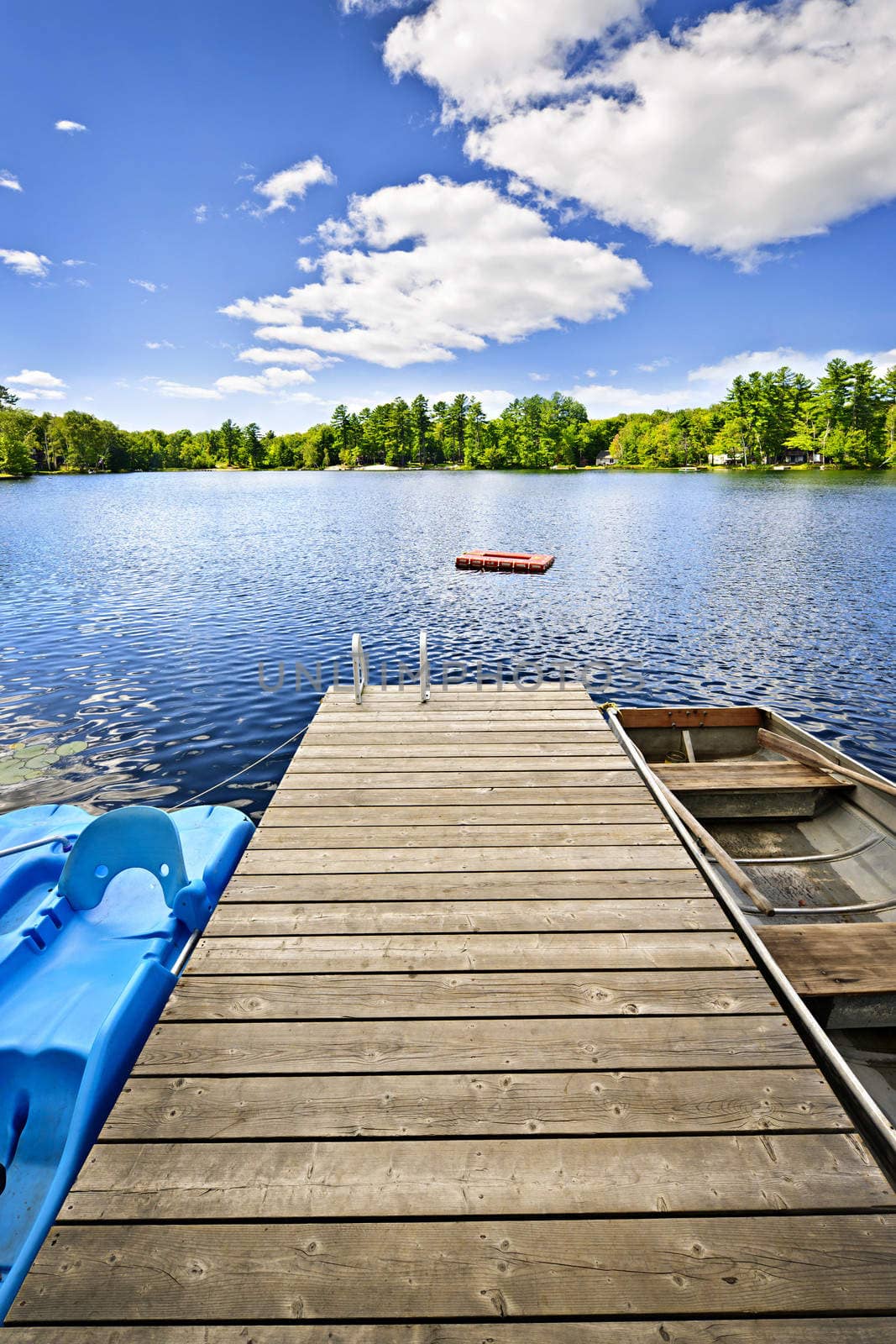 Wooden dock on beautiful summer lake in Ontario Canada