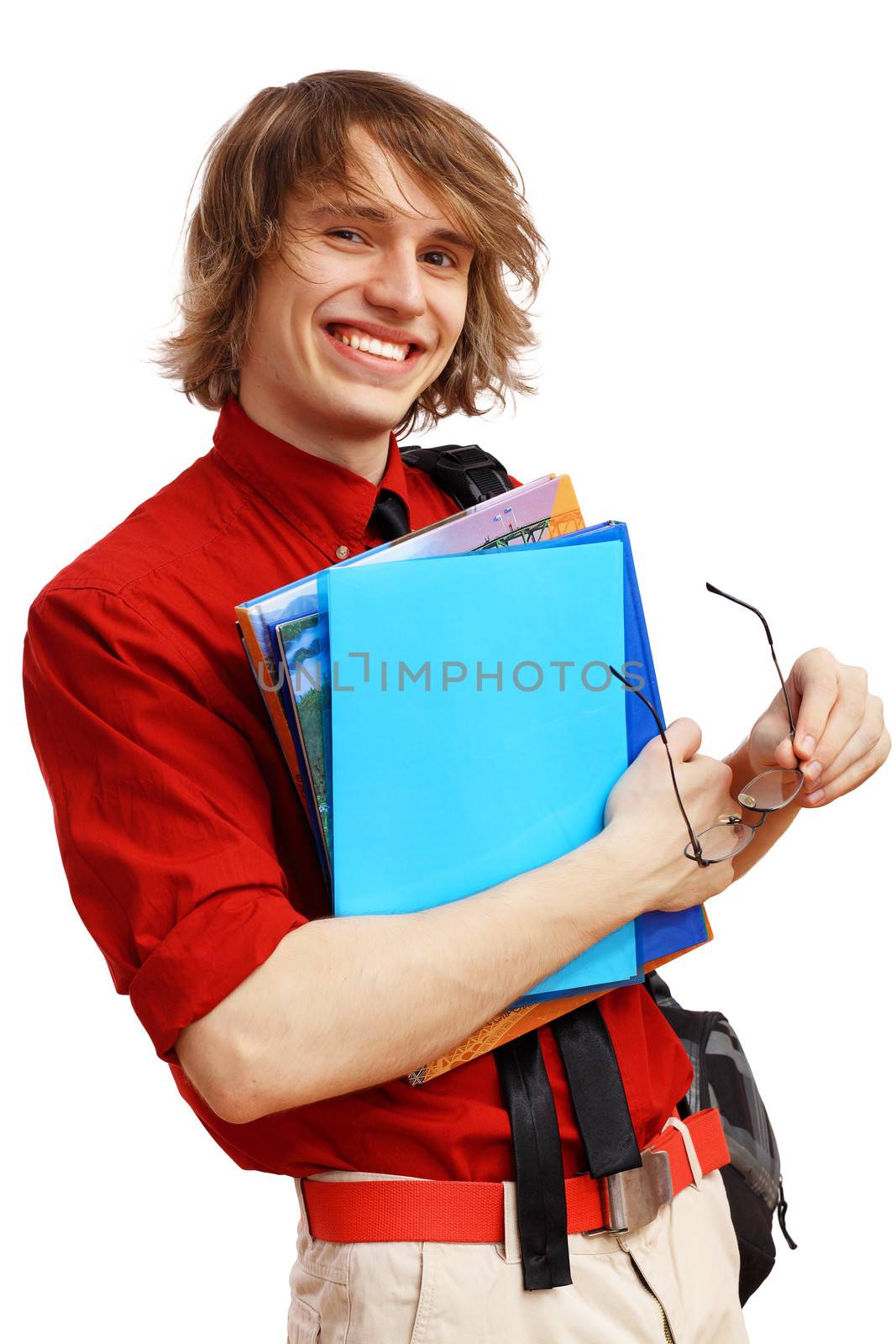 Happy smiling student standing and holding books