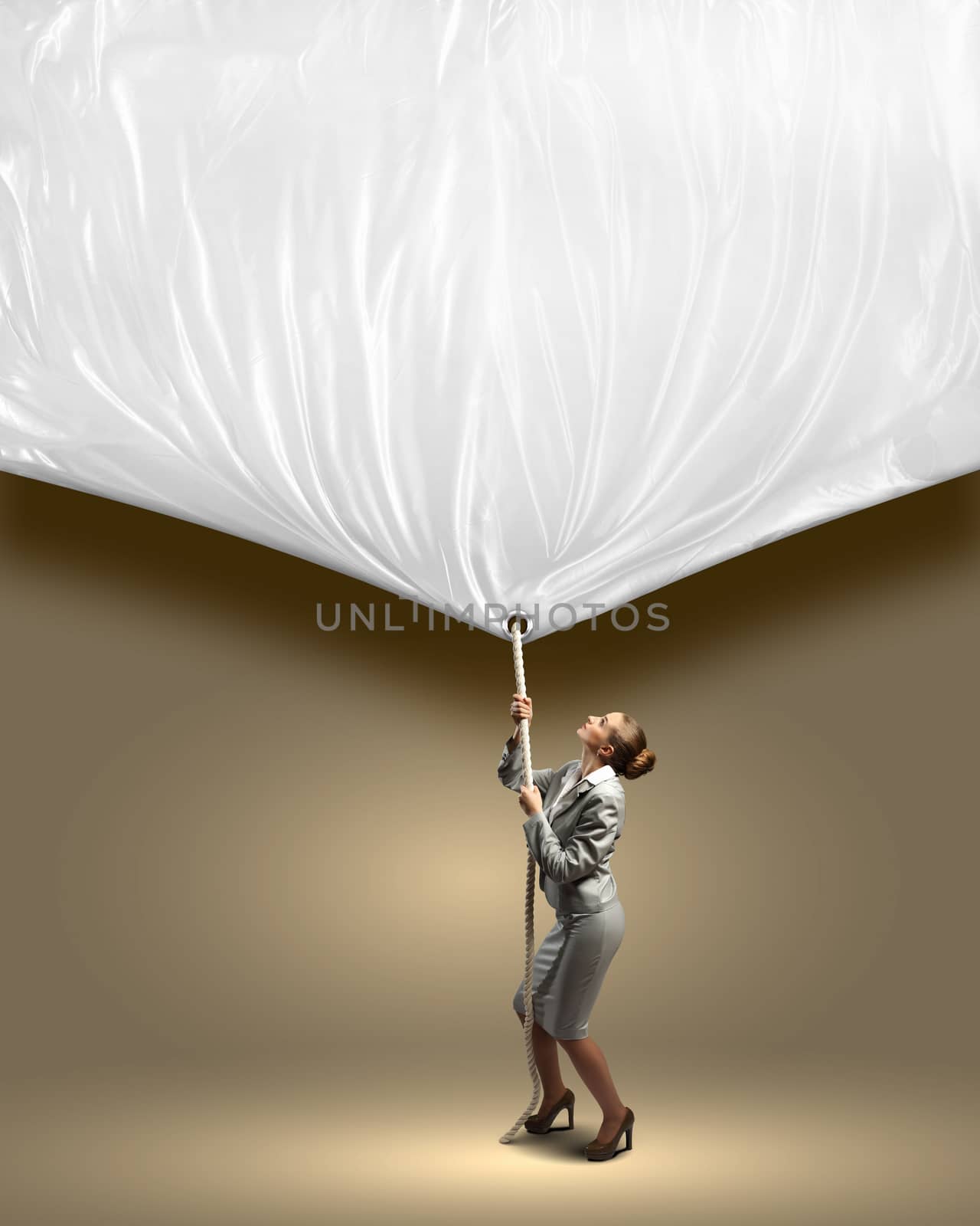 Image of businesswoman pulling blank banner. Place for text