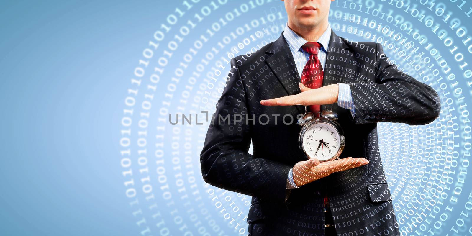 Business man holding alarmclock by sergey_nivens
