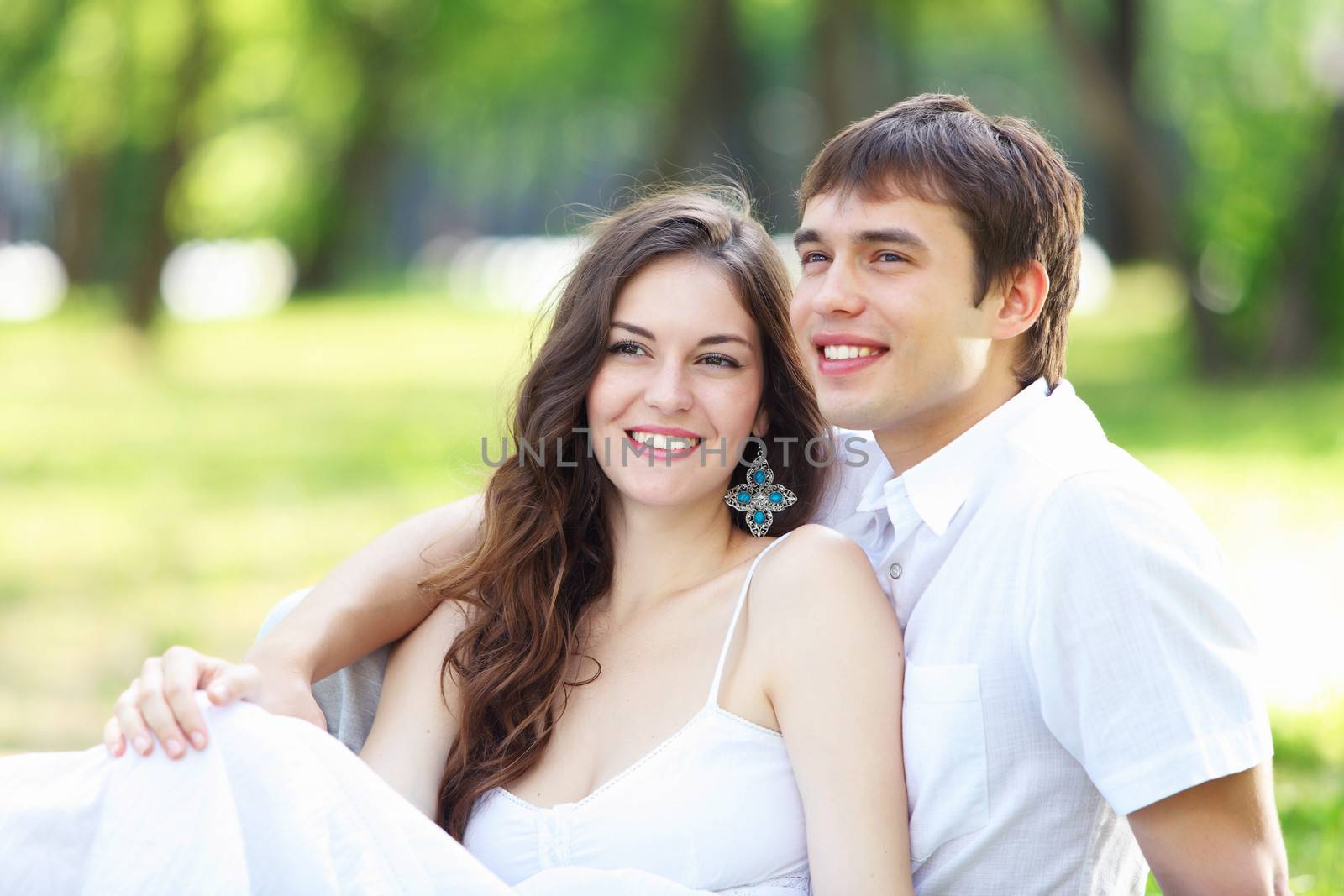 Young love Couple smiling under blue sky by sergey_nivens