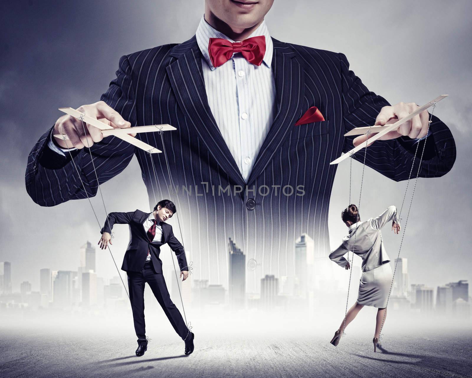 Image of young businessman puppeteer. Leadership concept