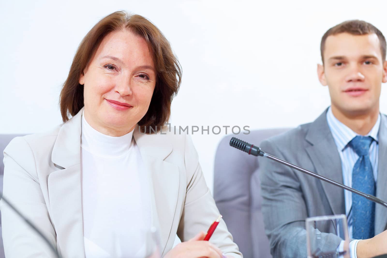 Image of two businesspeople sitting at table