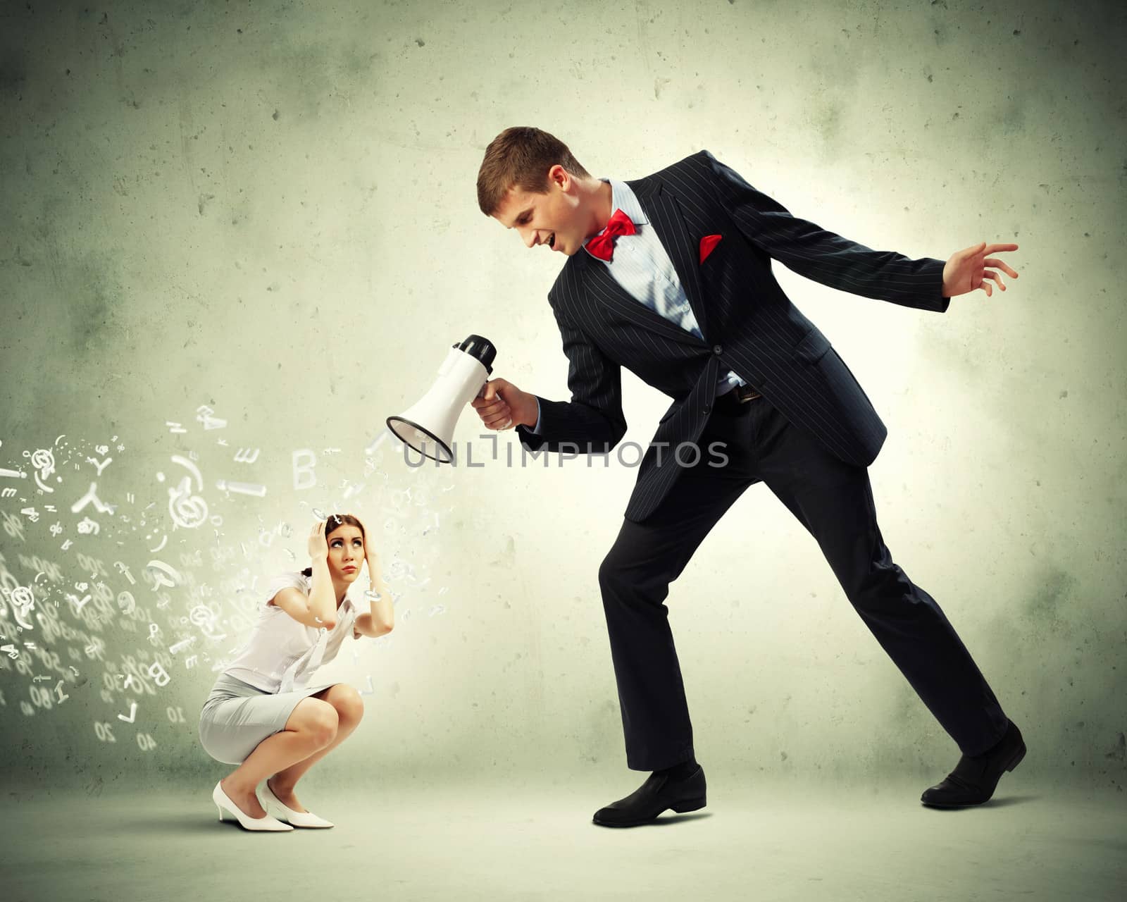 Angry businessman with megaphone shouting at colleague