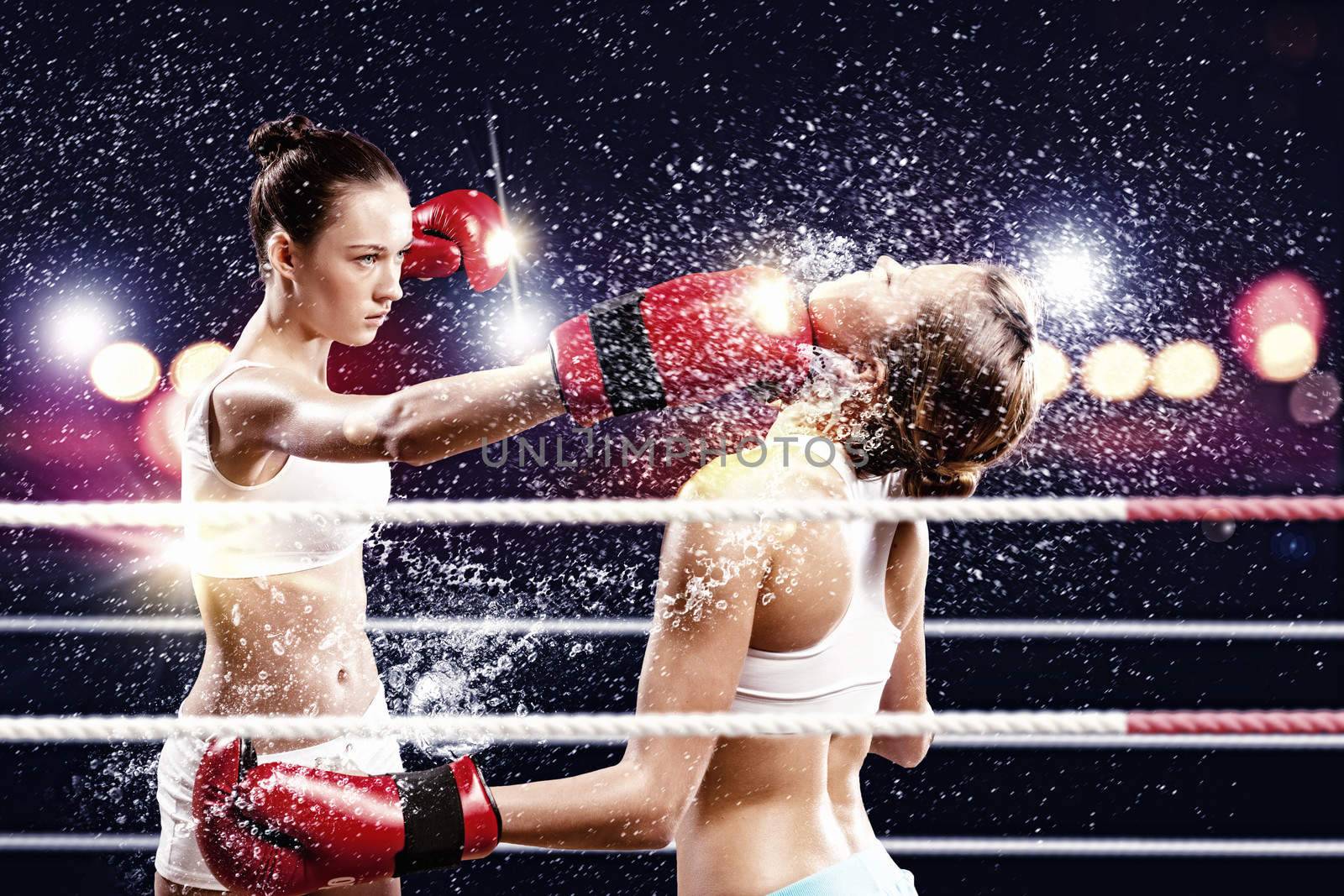 Two women boxing in ring by sergey_nivens