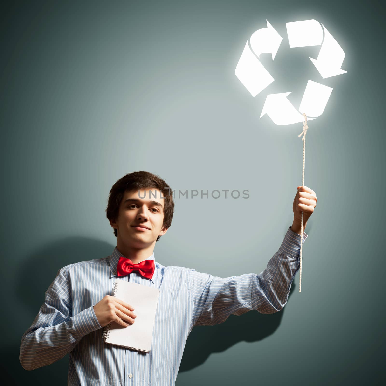 Image of young businessman with notebook. Recycling concept