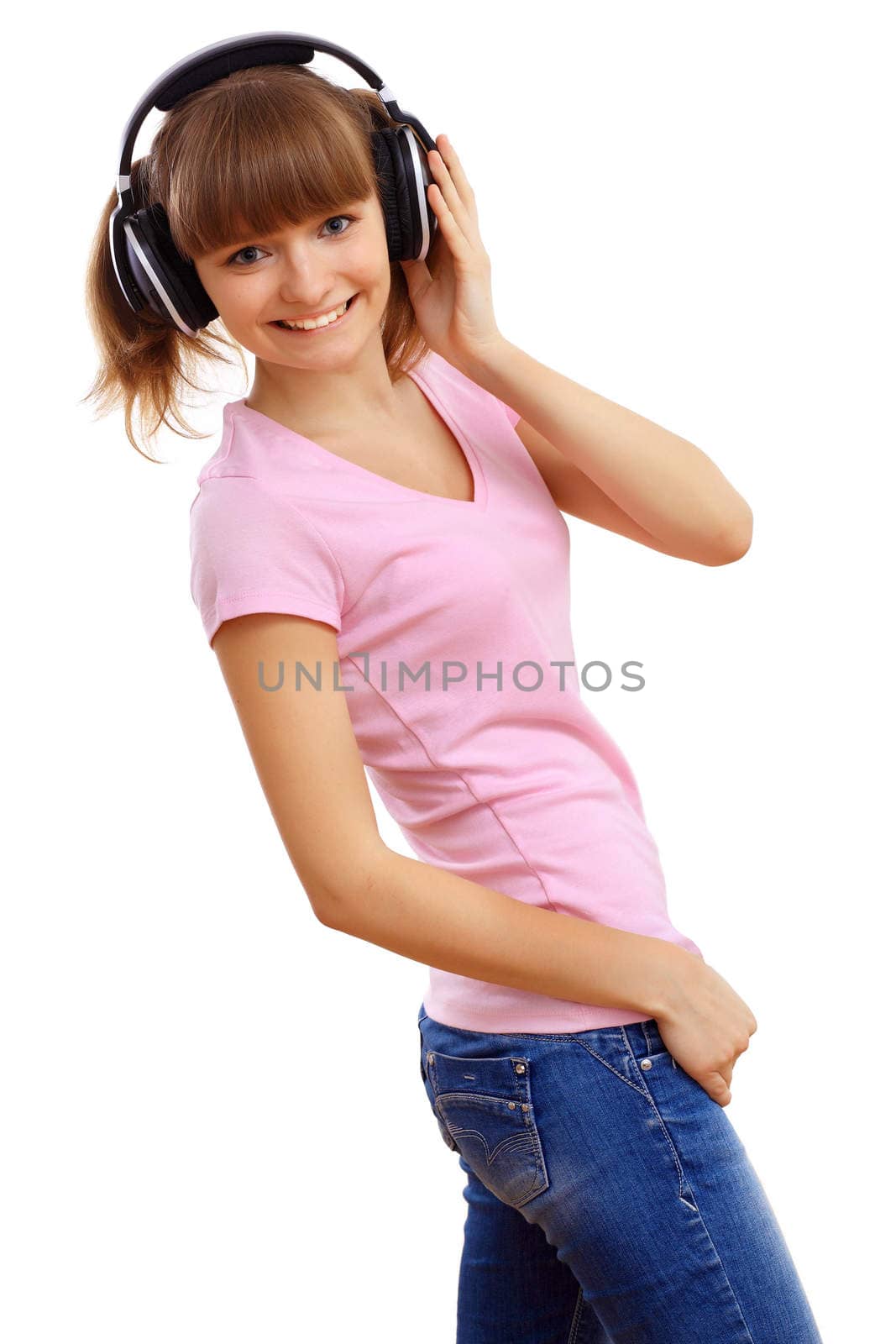 Happy smiling girl dancing and listening to music