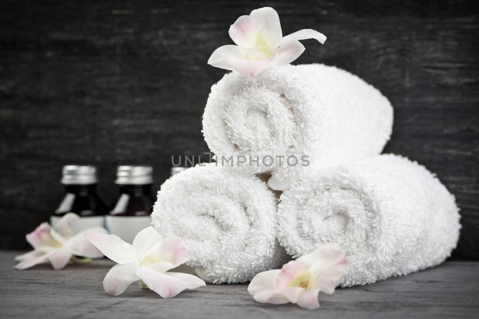 Rolled up towels at spa by elenathewise
