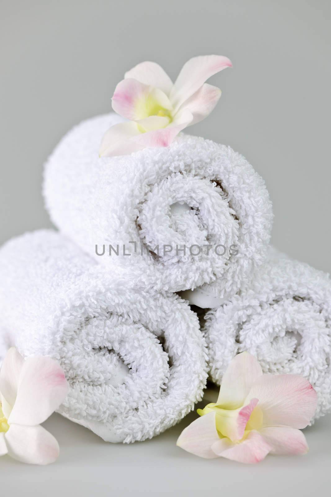 White rolled up spa towels by elenathewise
