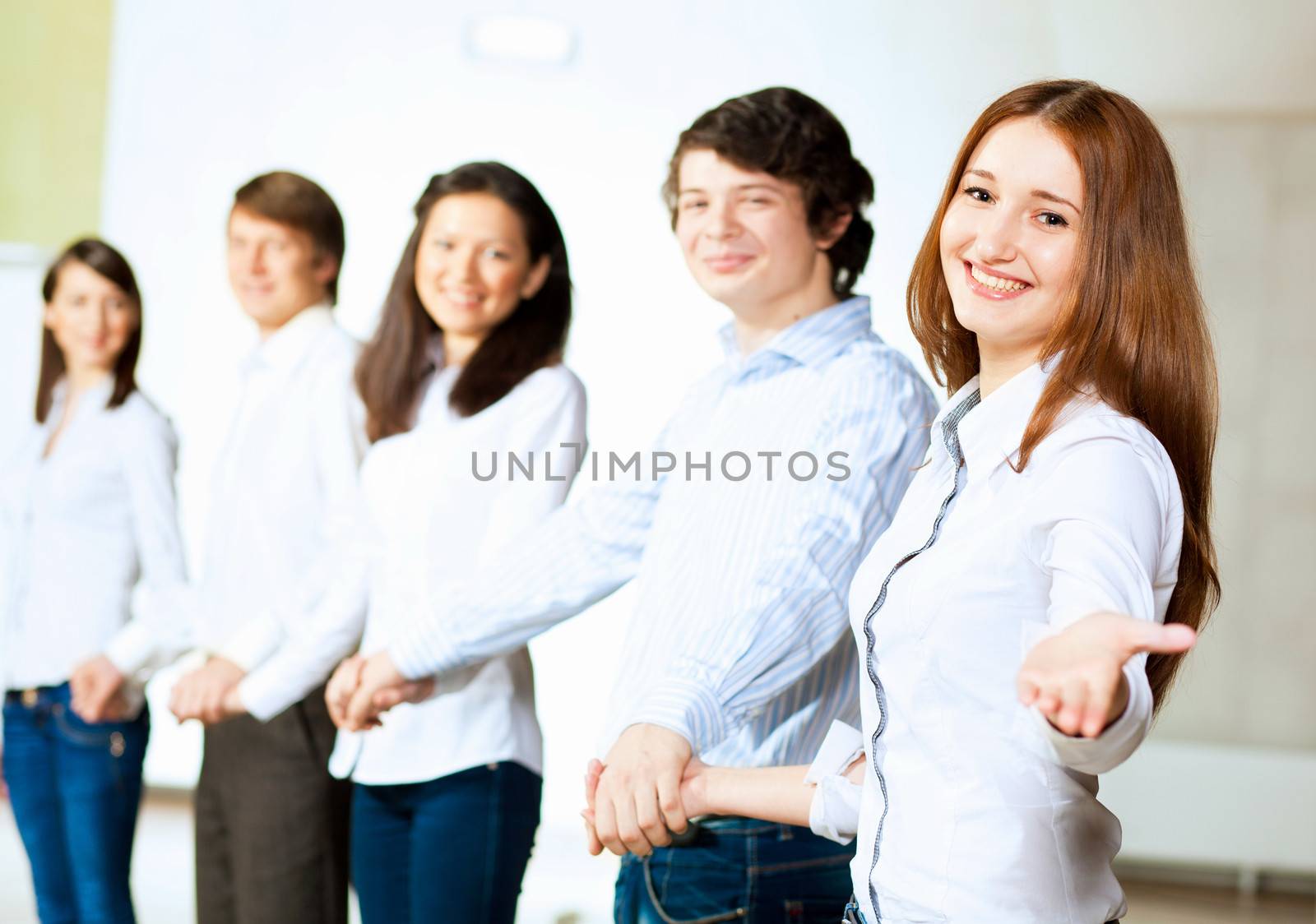 Image of five students in casual wear standing in row