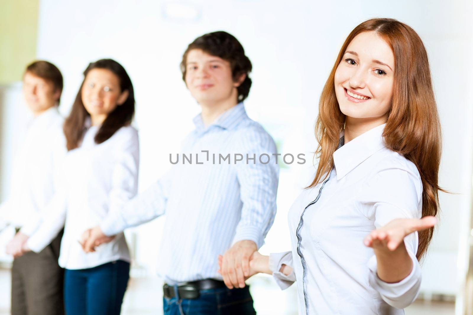 Image of five students in casual wear standing in row