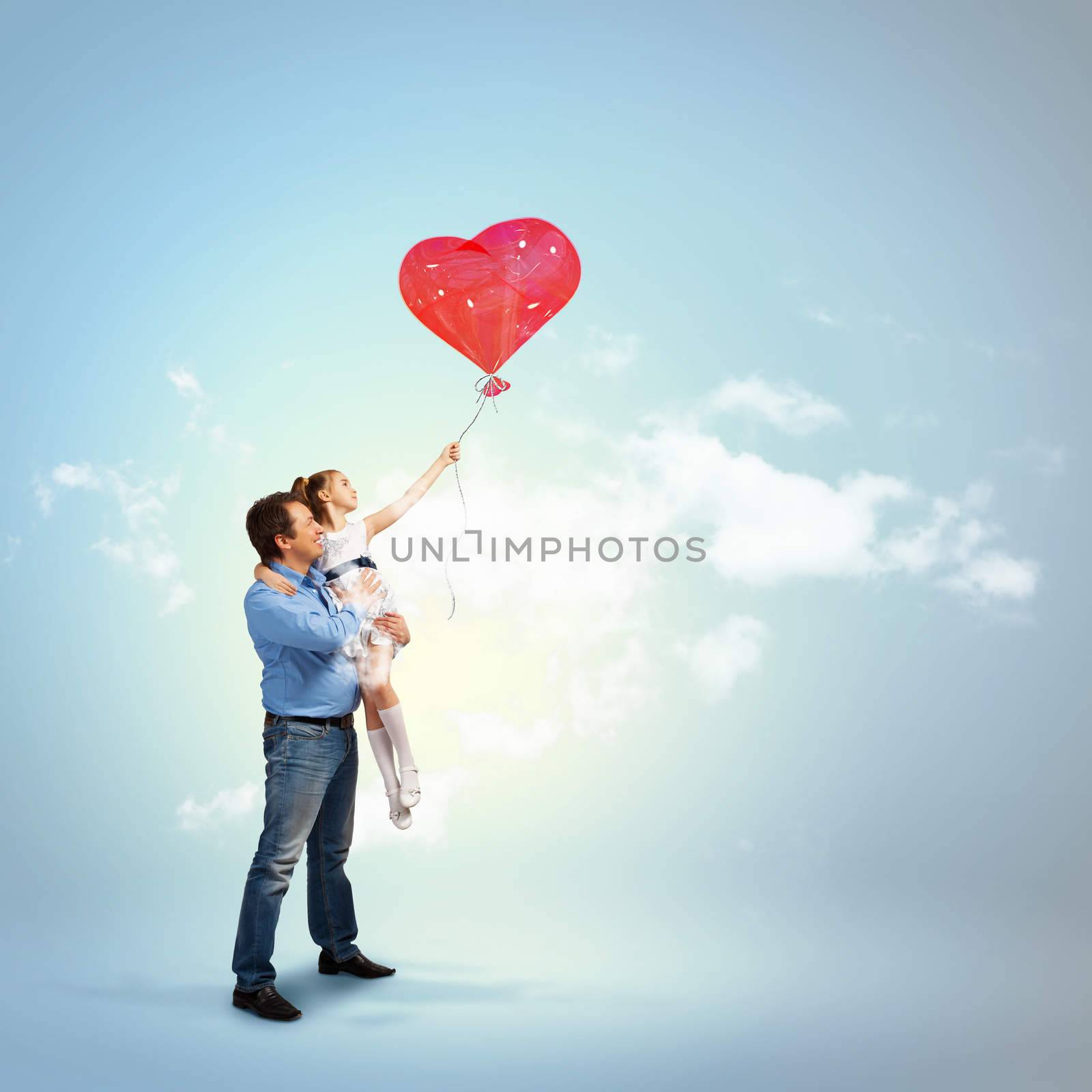 Image of happy father holding his daughter and a red heart baloon