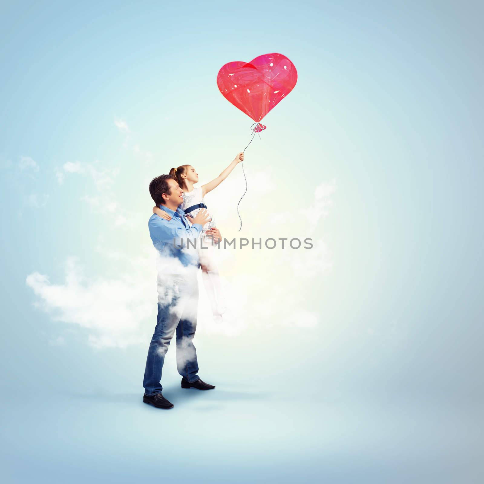 Image of happy father holding his daughter and a red heart baloon