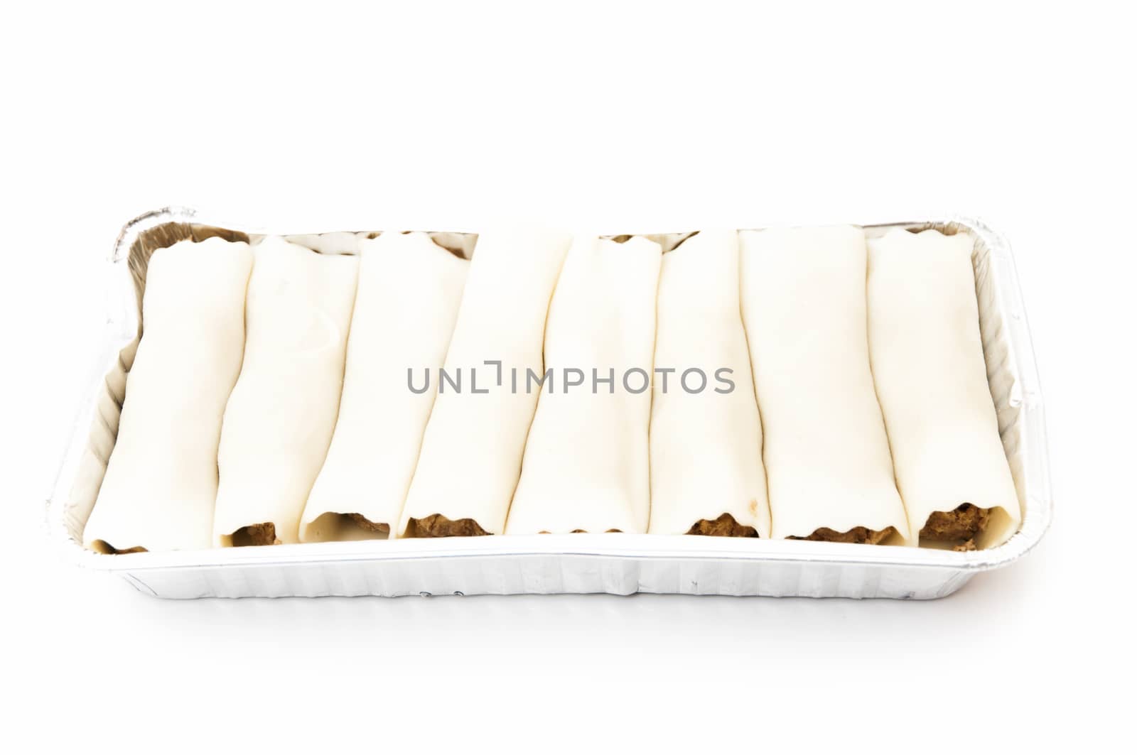 cannelloni in tray on a white background