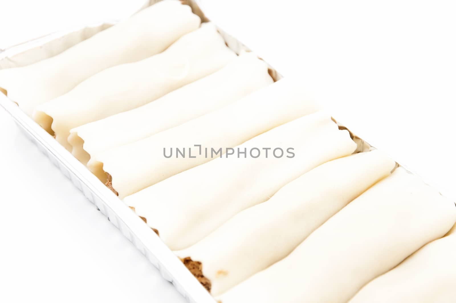 cannelloni in tray on a white background