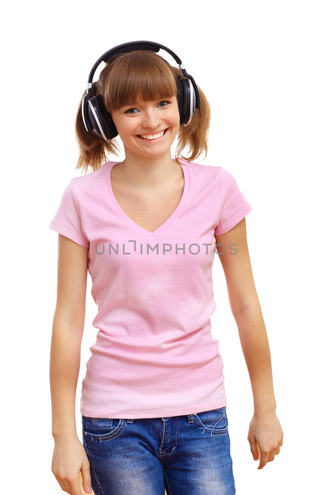 Happy smiling girl dancing and listening to music