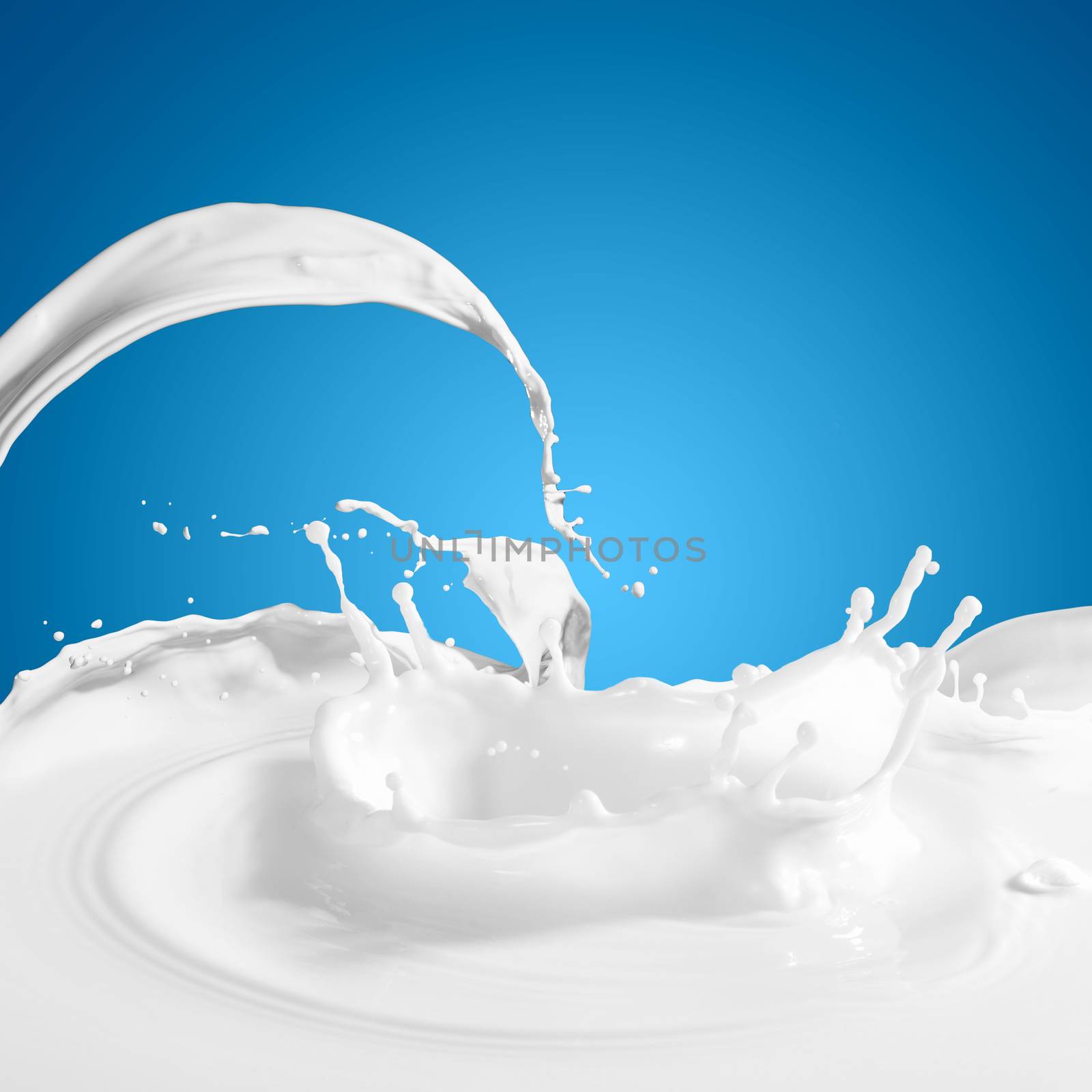 Pouring white milk splash on colour background