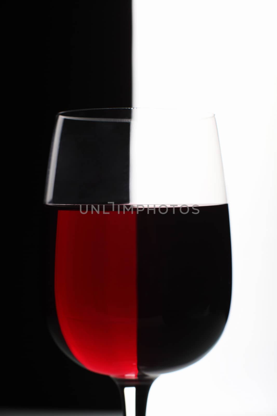 Glasses with wine on the color background