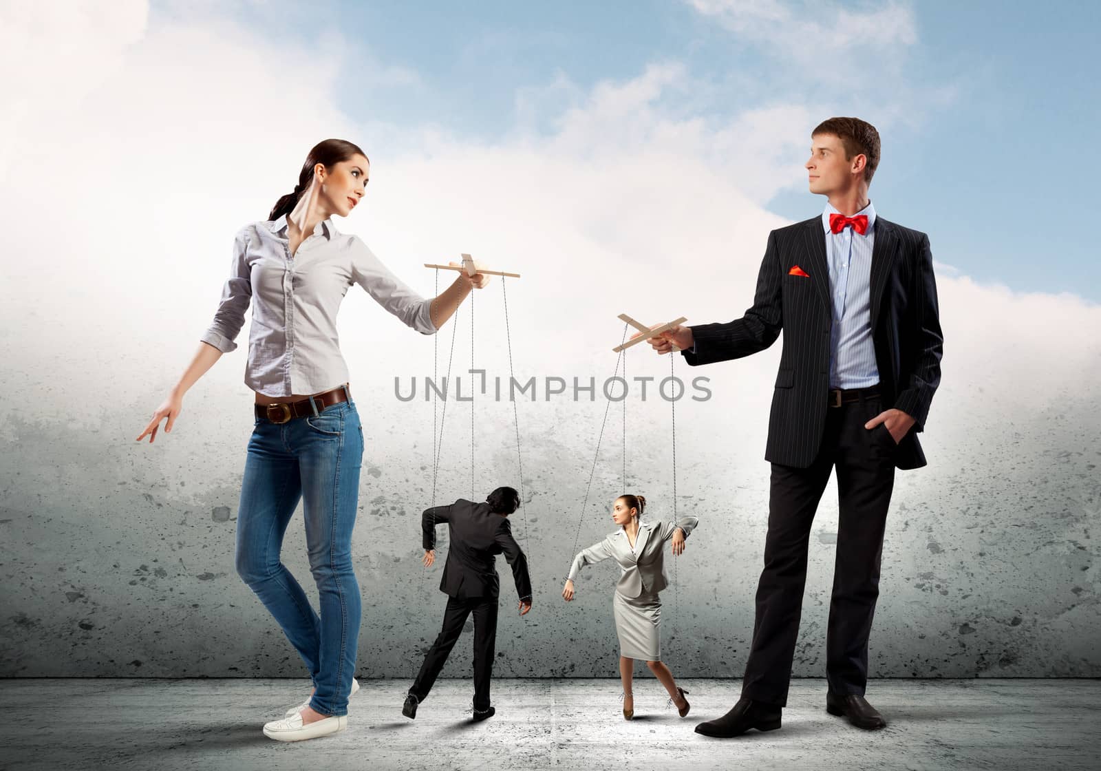 Image of man and woman with marionette puppets