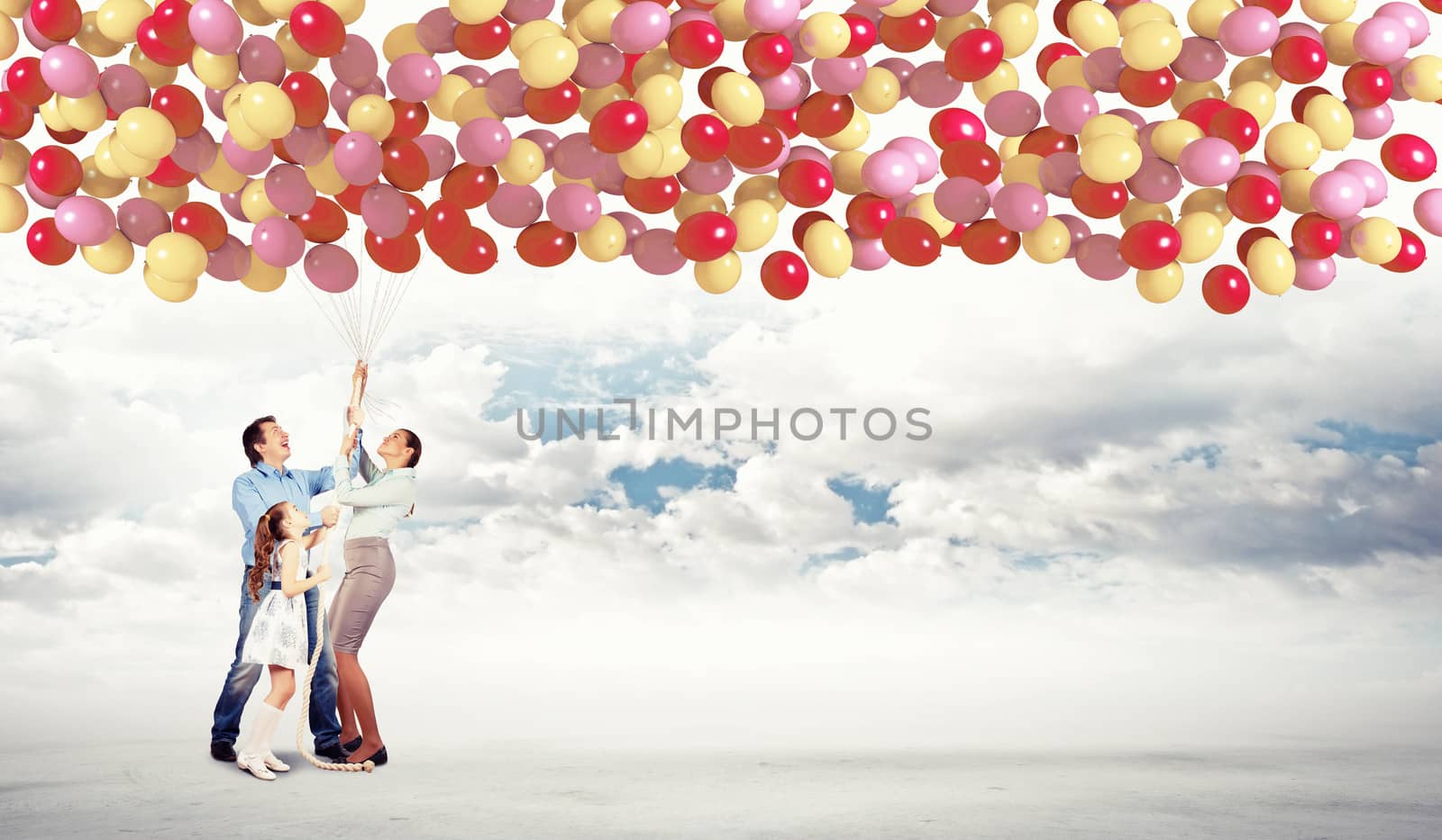 Image of happy family holding bunch colorful balloons