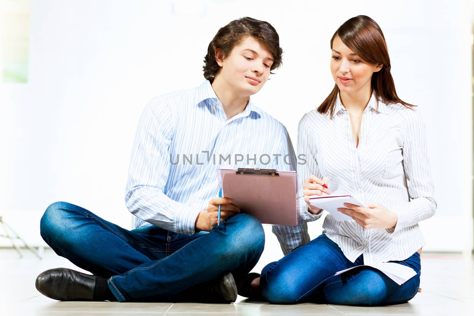 Image of two students discussing their work