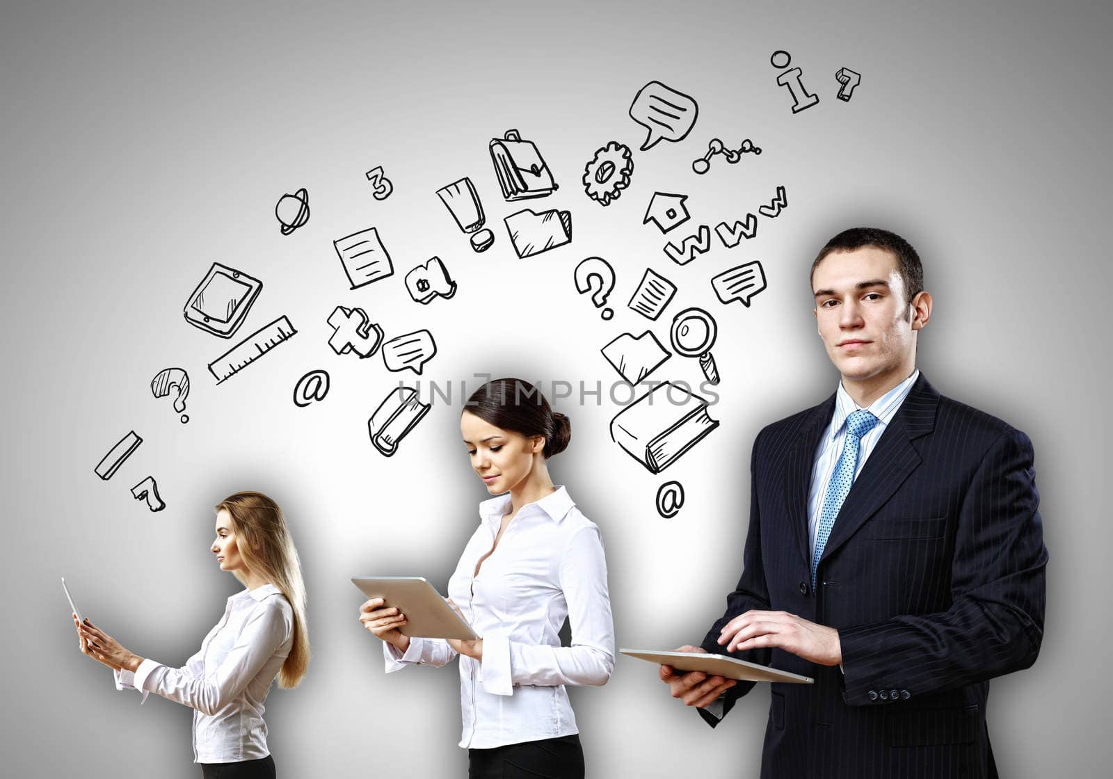 Three young people in business suits with tablet pc in hands