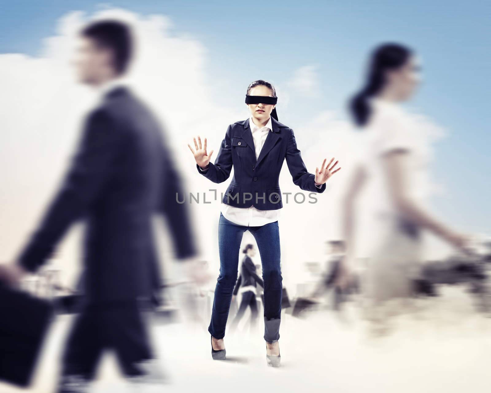 Image of businesswoman in blindfold walking among group of people