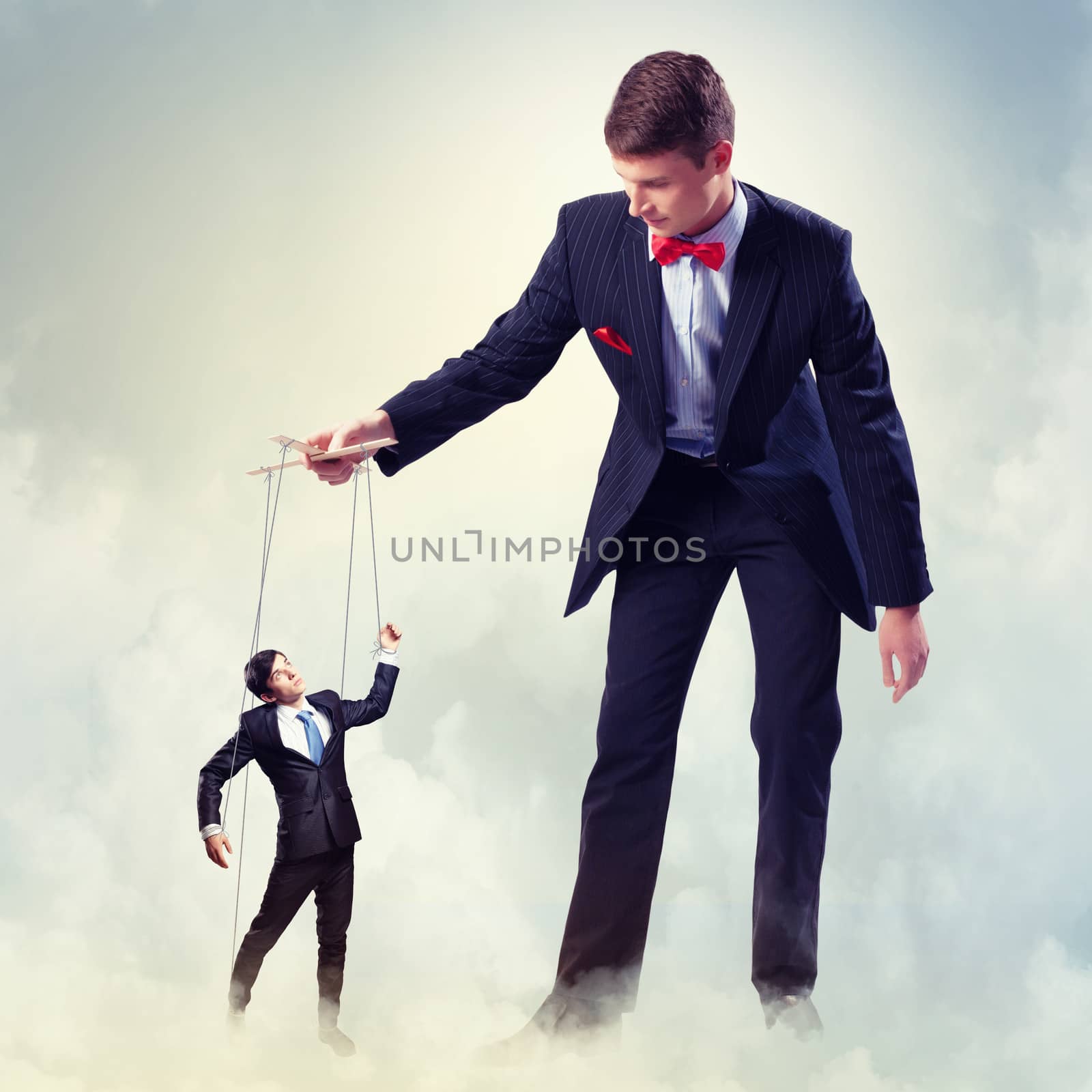 Image of young businessman puppeteer. Leadership concept