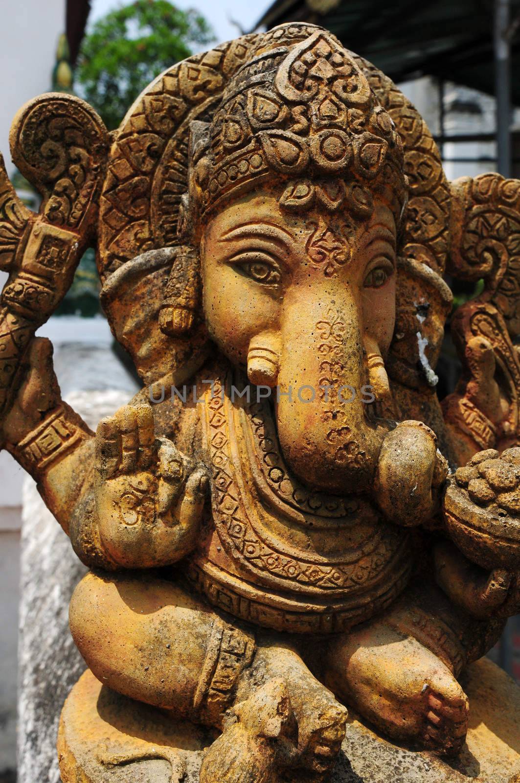 Ancient  sculpture of Indian god Lord Ganesh, god of luck and prosperity in Thailand