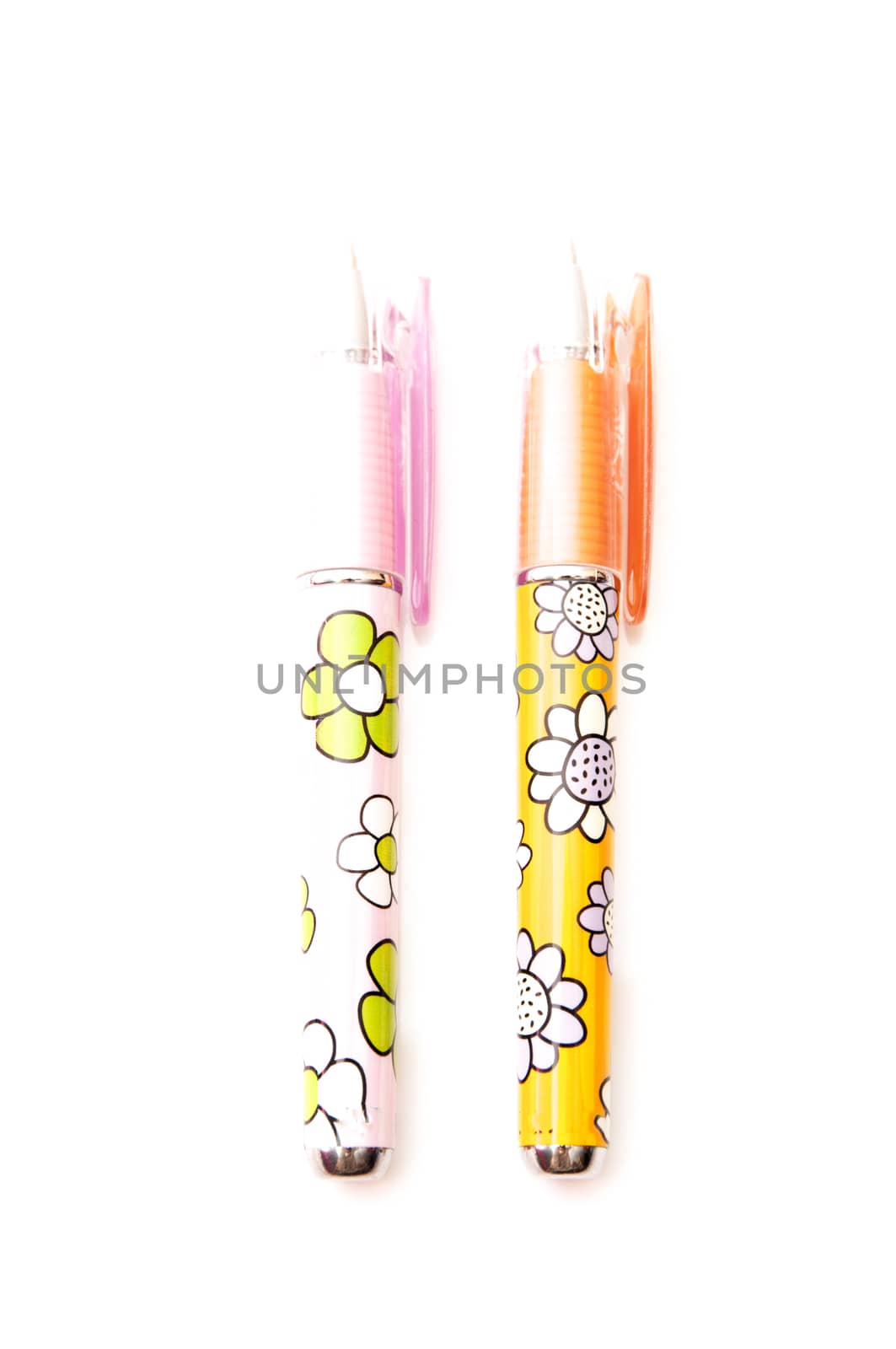 pens with flowers on a white background