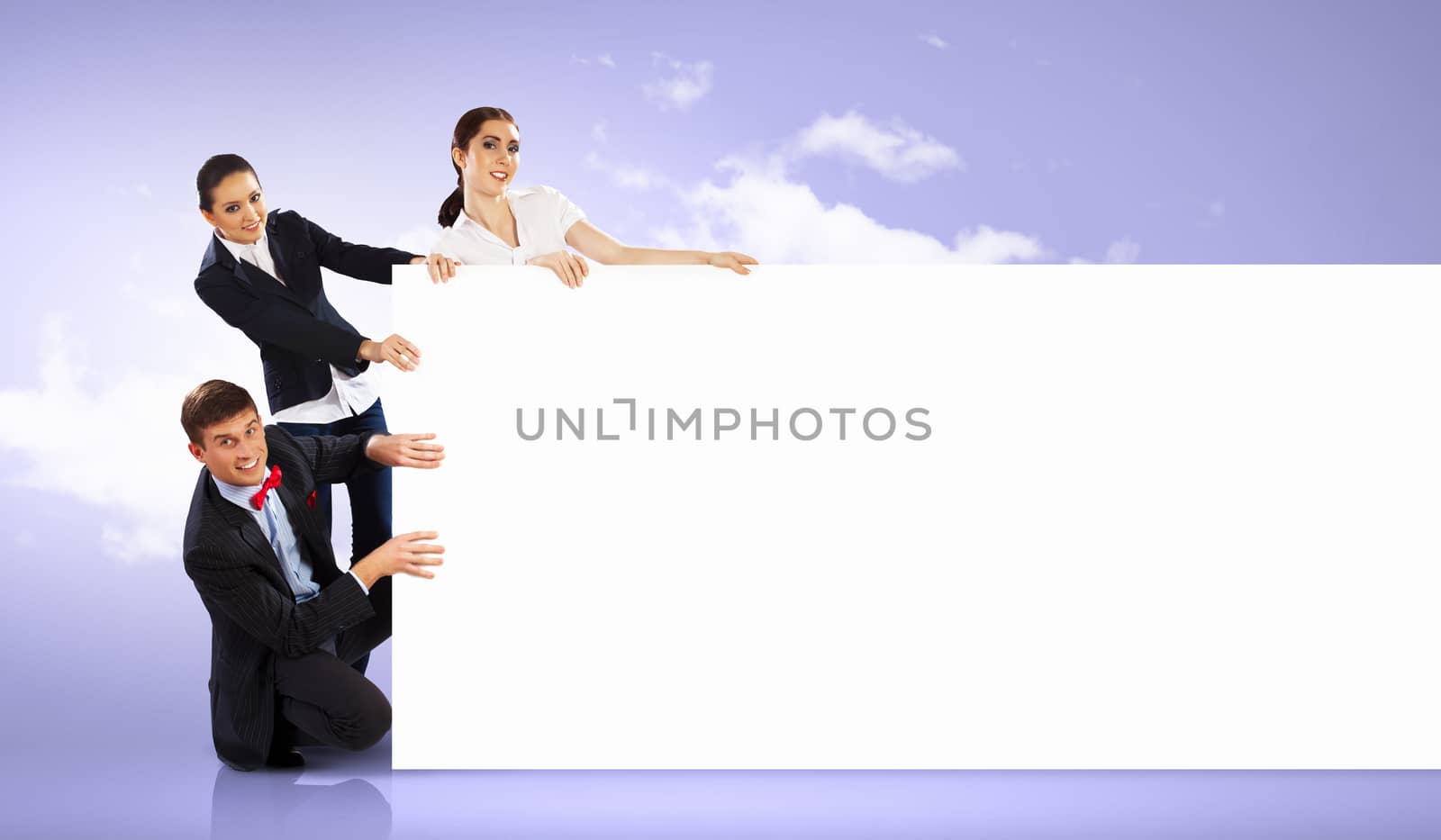 Image of three young people holding blank banner against purple background. Place for text