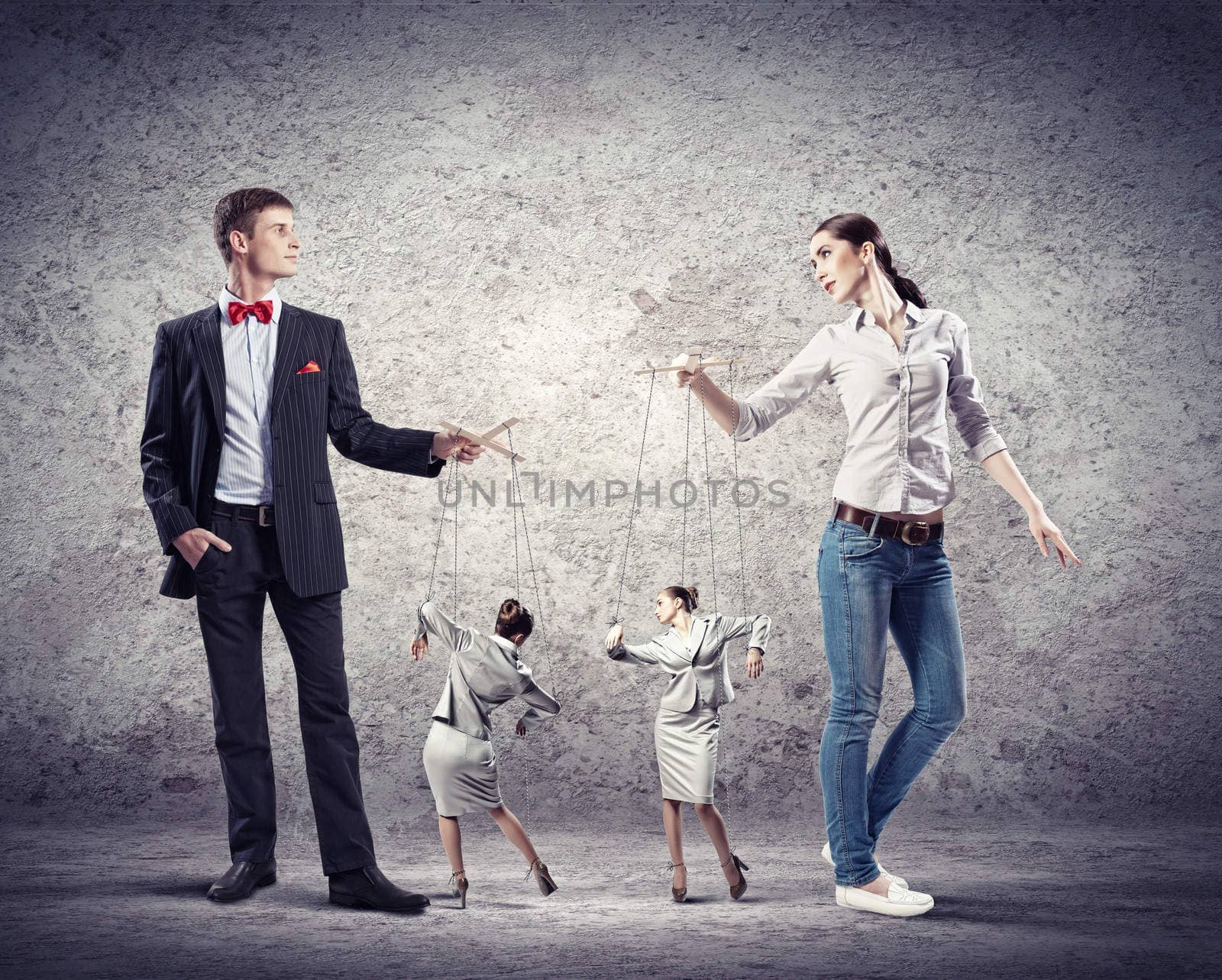 Image of man and woman with marionette puppets