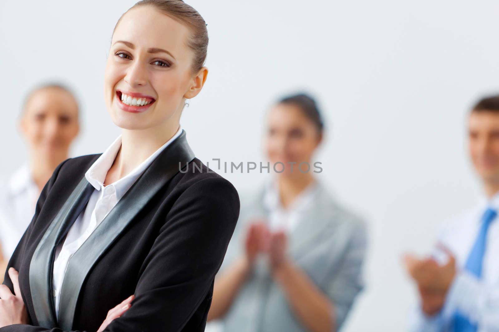 Image of four pretty young businesswomen standing in row