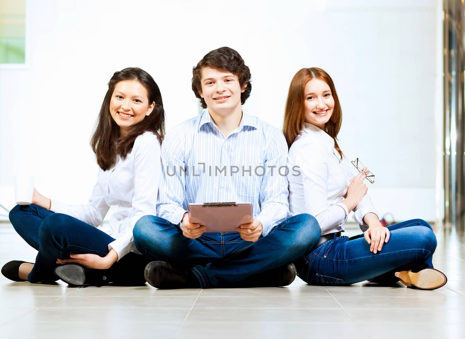 Three students smiling by sergey_nivens
